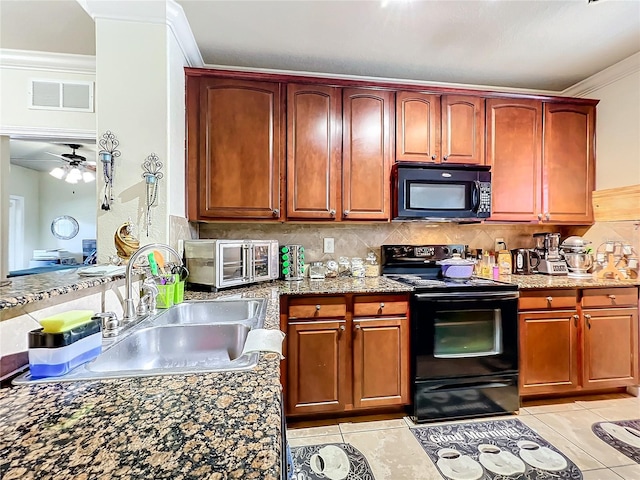 kitchen featuring backsplash, sink, black appliances, light tile patterned floors, and ceiling fan