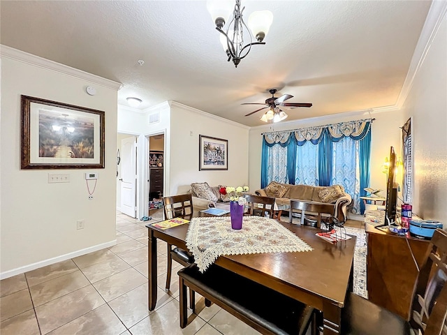 dining space featuring ceiling fan with notable chandelier, crown molding, light tile patterned flooring, and a textured ceiling