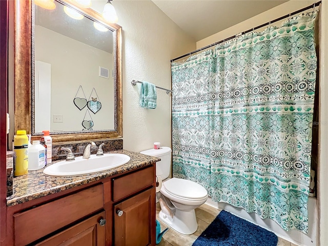 bathroom featuring tile patterned flooring, vanity, a shower with curtain, and toilet