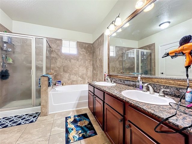 902 Charo Pkwy Unit 624, Davenport, FL 33897 - full bath featuring a stall shower, double vanity, tile patterned flooring, and a garden tub