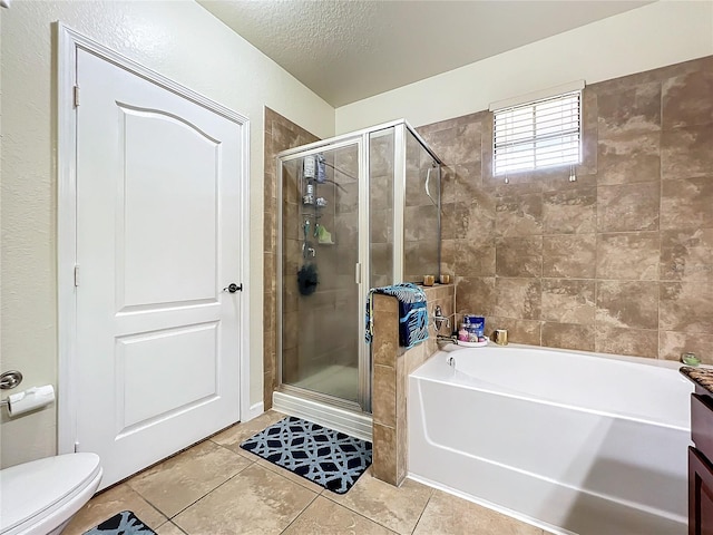 full bathroom with shower with separate bathtub, toilet, a textured ceiling, and tile patterned flooring