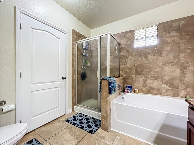 902 Charo Pkwy Unit 624, Davenport, FL 33897 - full bath featuring a stall shower, a bath, tile patterned floors, and a textured ceiling