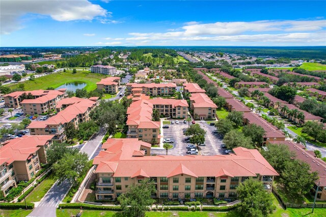 902 Charo Pkwy Unit 624, Davenport, FL 33897 - bird's eye view of apartment complex and a nearby body of water