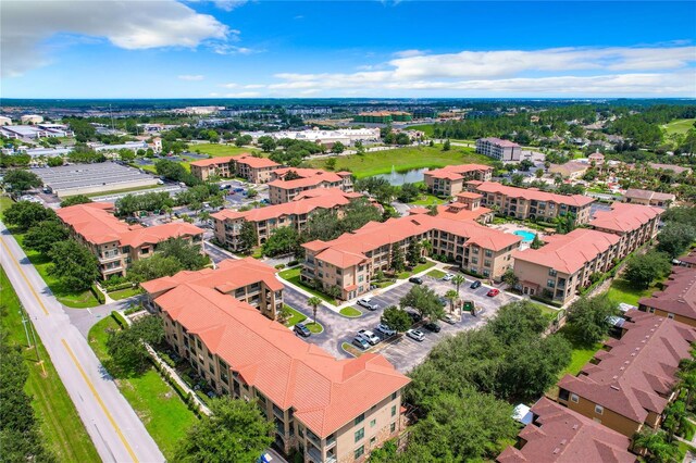 902 Charo Pkwy Unit 624, Davenport, FL 33897 - drone / aerial view of apartment complex / building and a nearby body of water