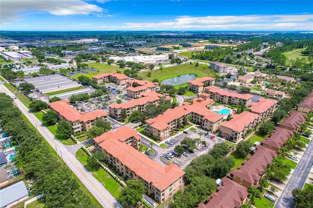 902 Charo Pkwy Unit 624, Davenport, FL 33897 - drone / aerial view of a nearby body of water, a pool, and apartment complex / building