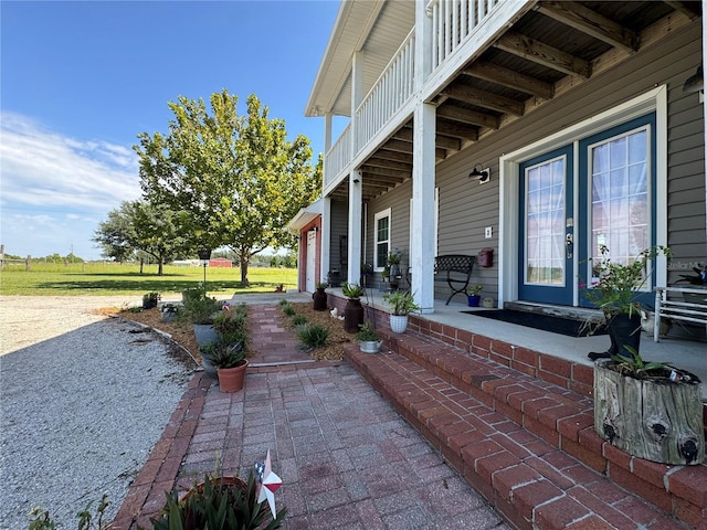 view of patio featuring a balcony