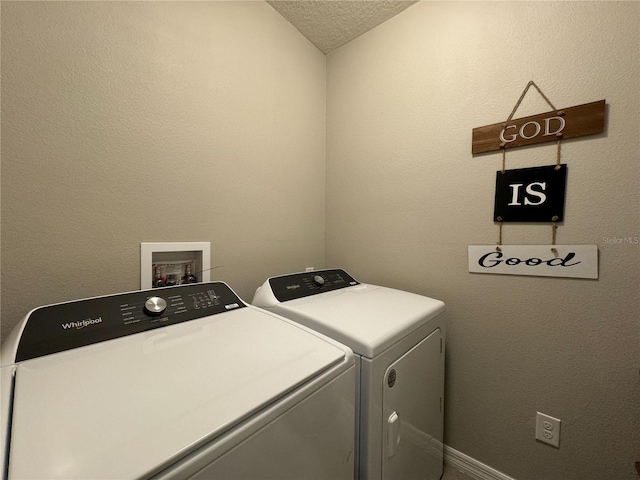 washroom featuring washer and dryer