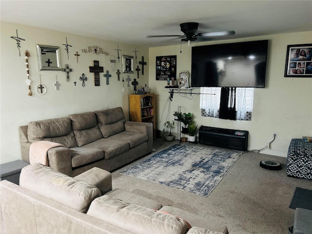 carpeted living room featuring ceiling fan