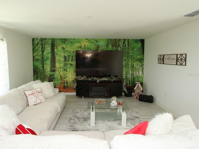 living room with light hardwood / wood-style flooring