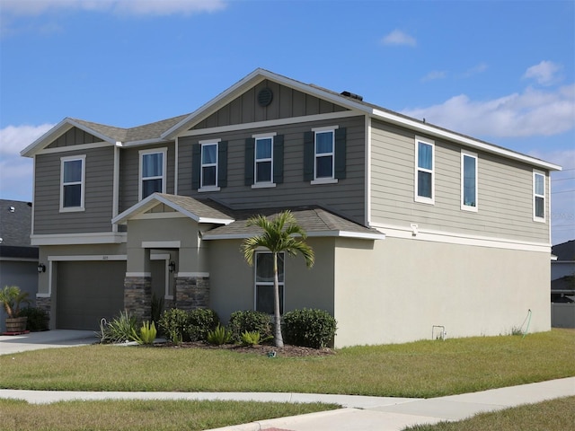 view of front of property with a front lawn and a garage