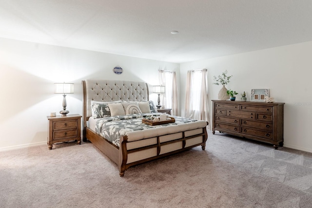 bedroom featuring light colored carpet