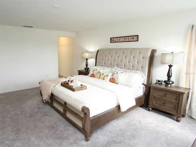 bedroom with light carpet