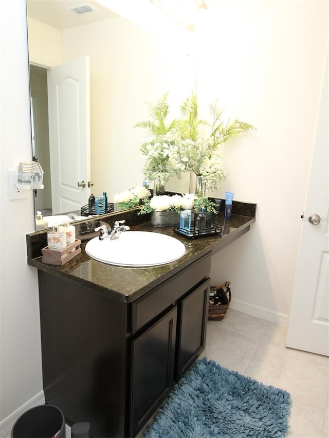 bathroom with vanity and tile patterned floors