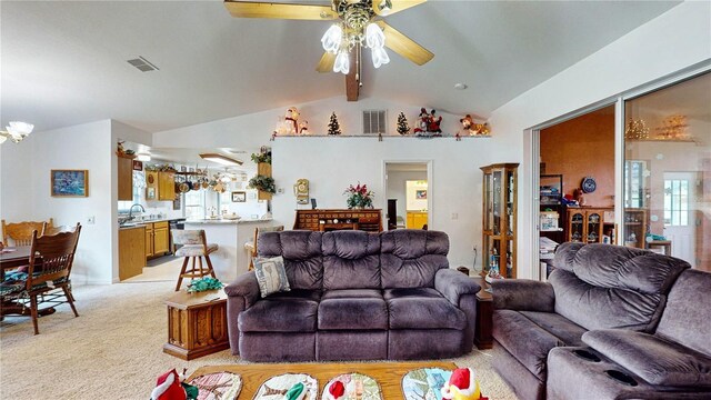 living room with ceiling fan, light carpet, and lofted ceiling with beams