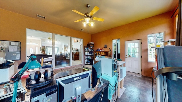 tiled office featuring ceiling fan