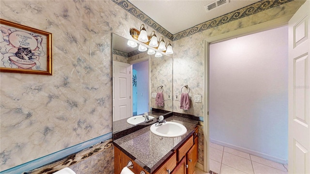 bathroom featuring tile patterned flooring and vanity