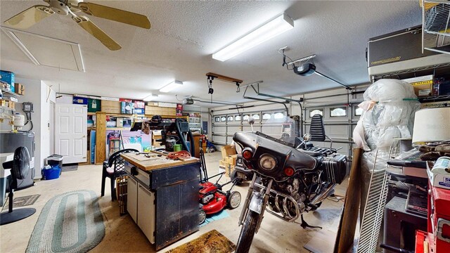 garage featuring ceiling fan, a garage door opener, and washer / clothes dryer