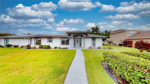 prairie-style home with a front lawn