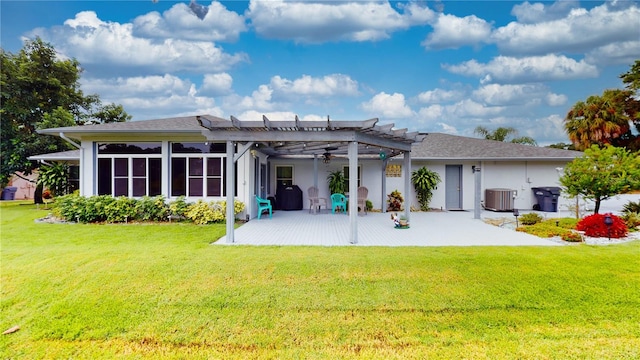 back of property with a pergola, a patio, central AC, and a lawn