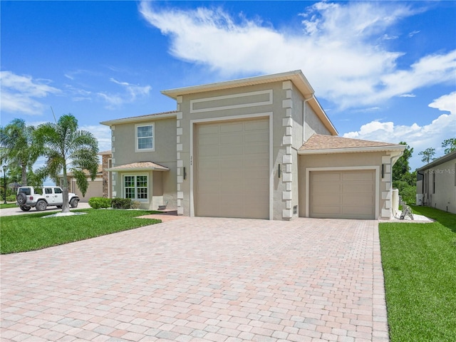 view of front facade with a garage and a front yard