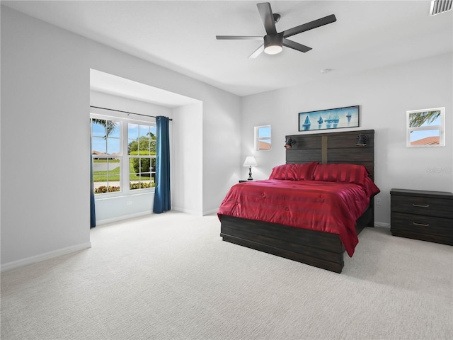 bedroom with light carpet and ceiling fan