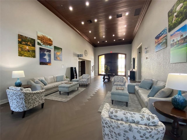 living room featuring wooden ceiling, ornamental molding, and a high ceiling