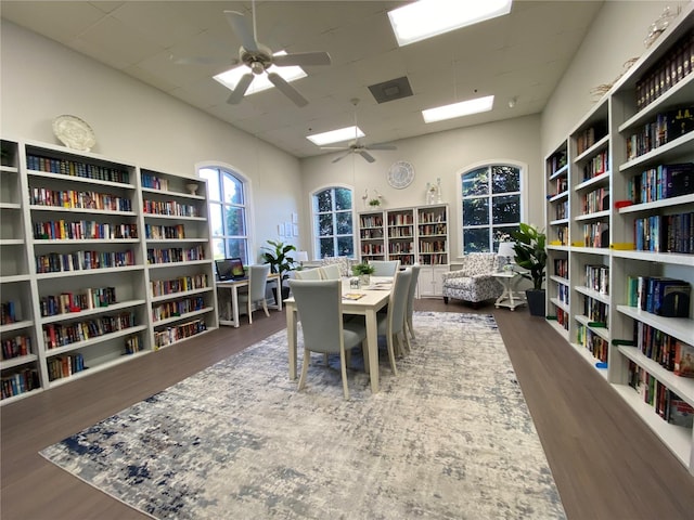 office space with dark wood-type flooring and ceiling fan