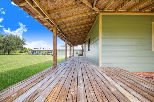 wooden terrace with a yard