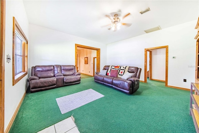 living room featuring carpet floors and ceiling fan