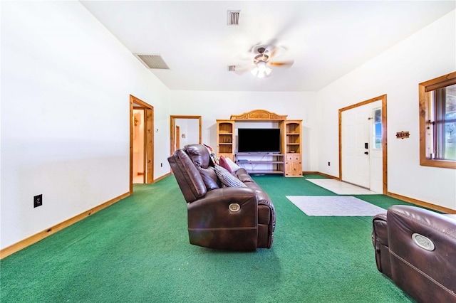 interior space with carpet floors, visible vents, and a ceiling fan