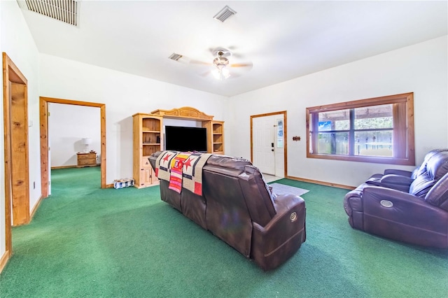 living room featuring ceiling fan and carpet