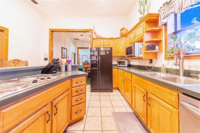 kitchen featuring white appliances, light tile patterned floors, dark countertops, open shelves, and a sink