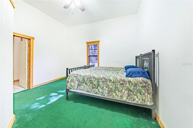 bedroom with ceiling fan, high vaulted ceiling, and carpet flooring