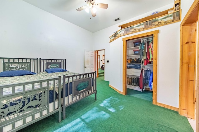 bedroom with ceiling fan, carpet flooring, and a closet