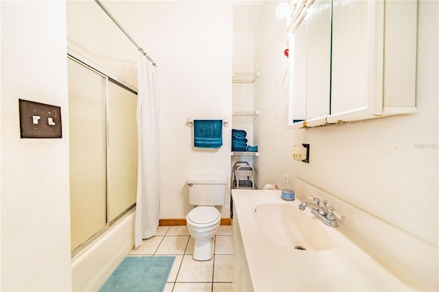 full bathroom featuring tile patterned floors, toilet, shower / bath combo with shower curtain, and vanity