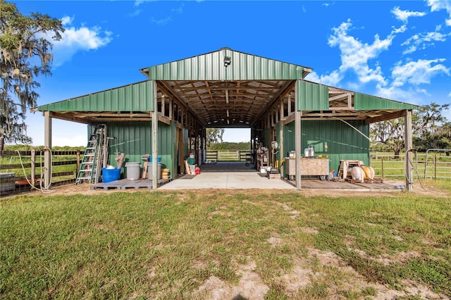 view of outbuilding with a yard