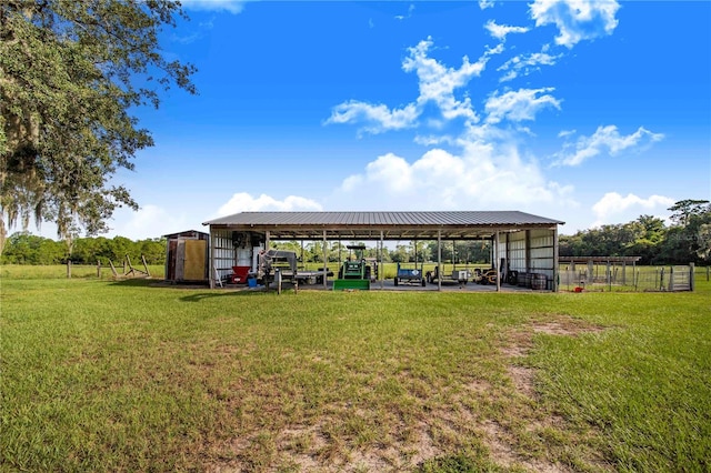 exterior space with a lawn and an outbuilding