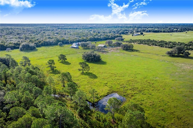 birds eye view of property with a rural view