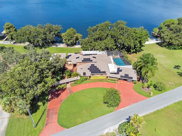 birds eye view of property with a water view