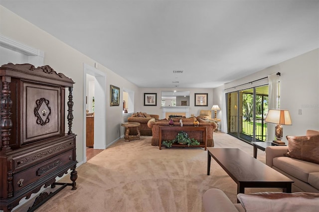 living room featuring light carpet