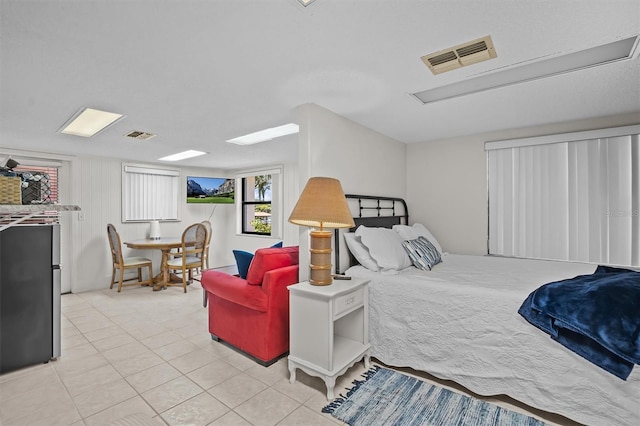 bedroom featuring light tile patterned floors