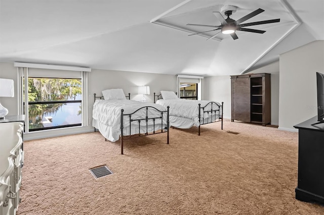 carpeted bedroom with lofted ceiling and ceiling fan