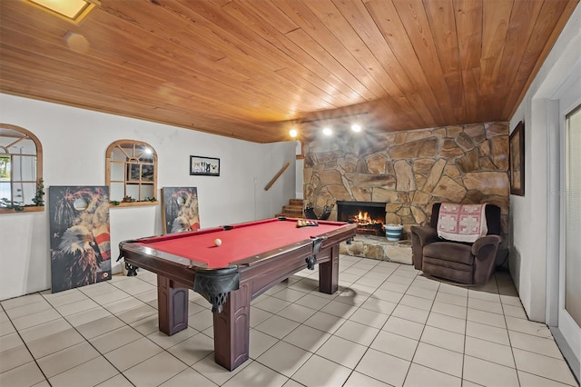 recreation room with pool table, light tile patterned floors, wooden ceiling, and a fireplace