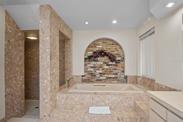 bathroom featuring vanity and shower with separate bathtub