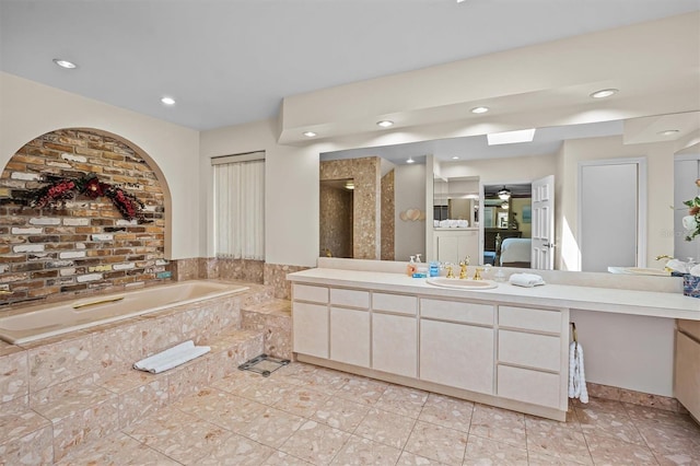 bathroom featuring vanity, ceiling fan, and shower with separate bathtub