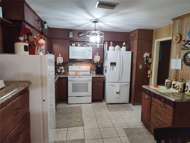 kitchen with light tile patterned floors and white appliances