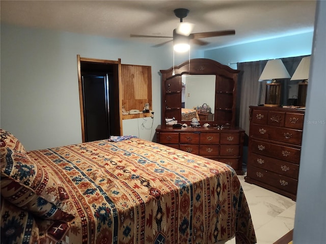 tiled bedroom with ceiling fan