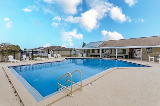 view of swimming pool featuring a patio area