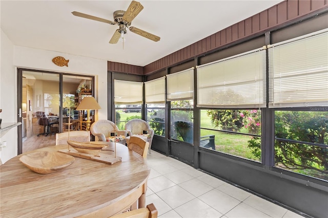 sunroom / solarium with ceiling fan and a healthy amount of sunlight