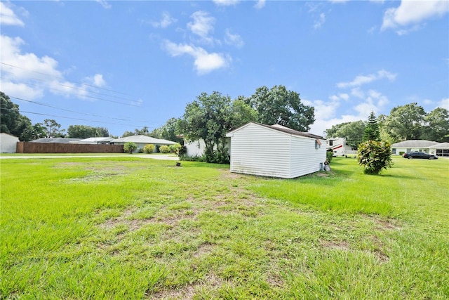 view of yard with a storage unit